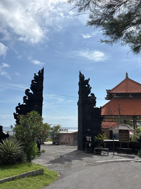 Morning scenes captured in Mengwi: traditional gate, roadside fruit stall