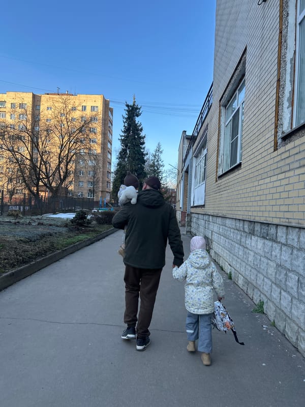 Family with young children documented during early morning outing in Klin