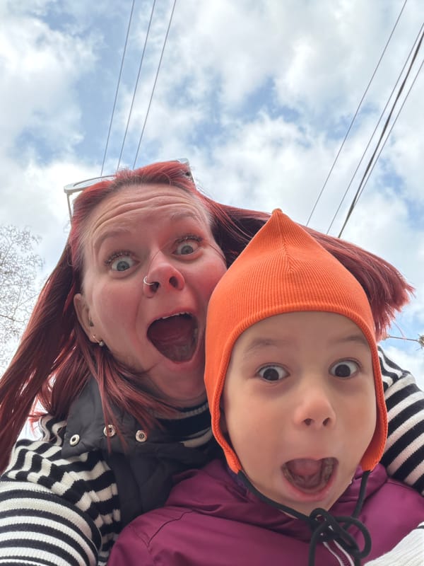 Adult and child share playful selfie moment in Chaikovsky