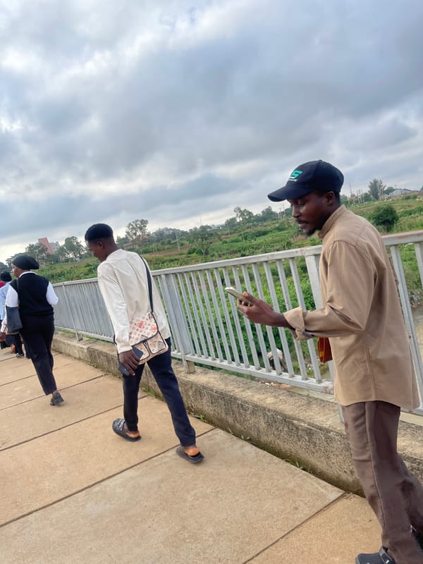 Morning foot traffic and motorbikes on a Nigerian campus bridge