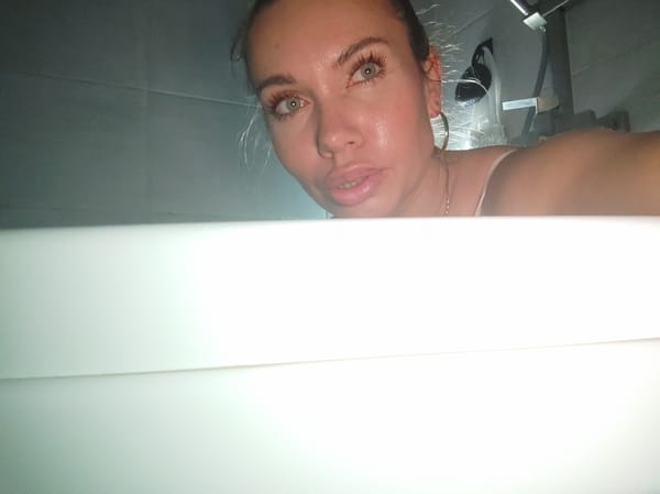 Woman photographed in bathroom setting in Votkinsk, Russia