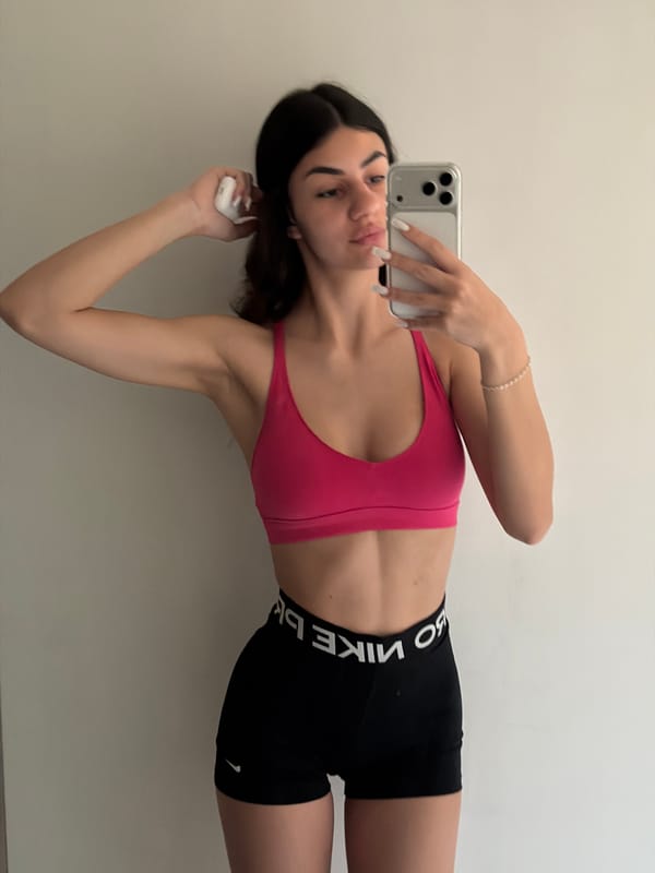 Woman takes indoor selfies in sportswear in Gabrovo