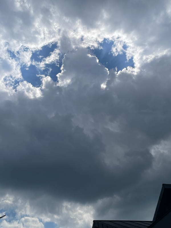 Dramatic storm skies over the city, with quiet indoor moments