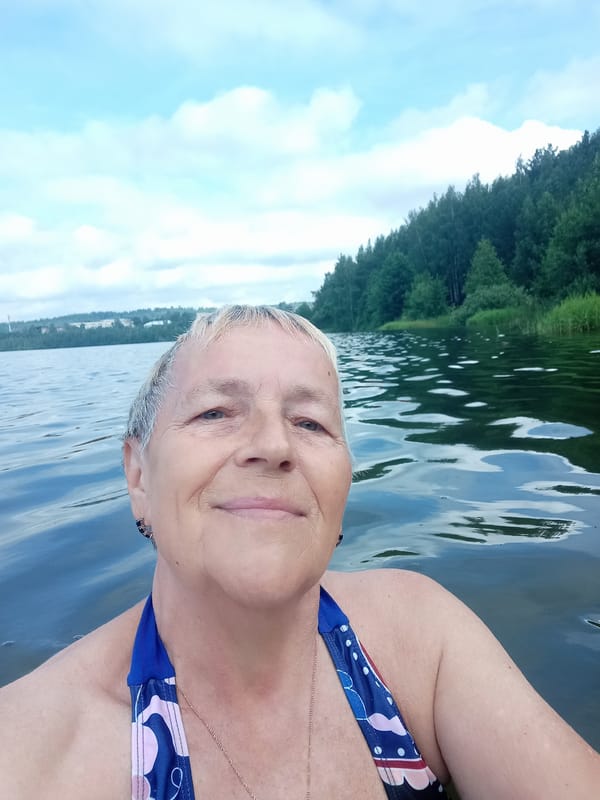 Lakeside fishing and swimming on a summer morning in Degtyarsk