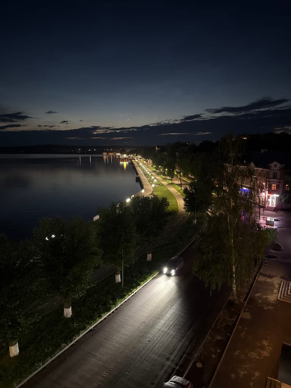 Votkinsk embankment at night, reservoir reflecting city lights