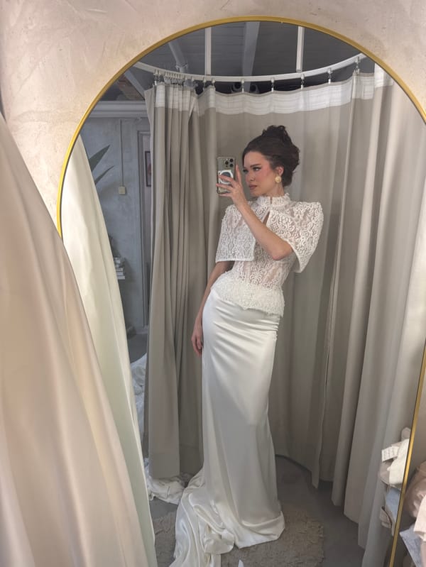 Bride tries on wedding dresses at Bat Yam boutique