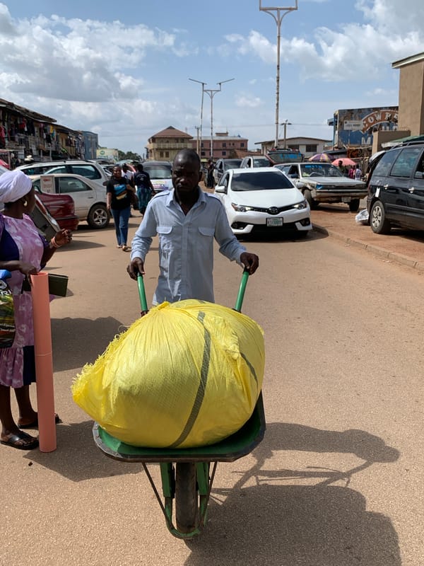 Midday street life and market movement in Jos, Nigeria