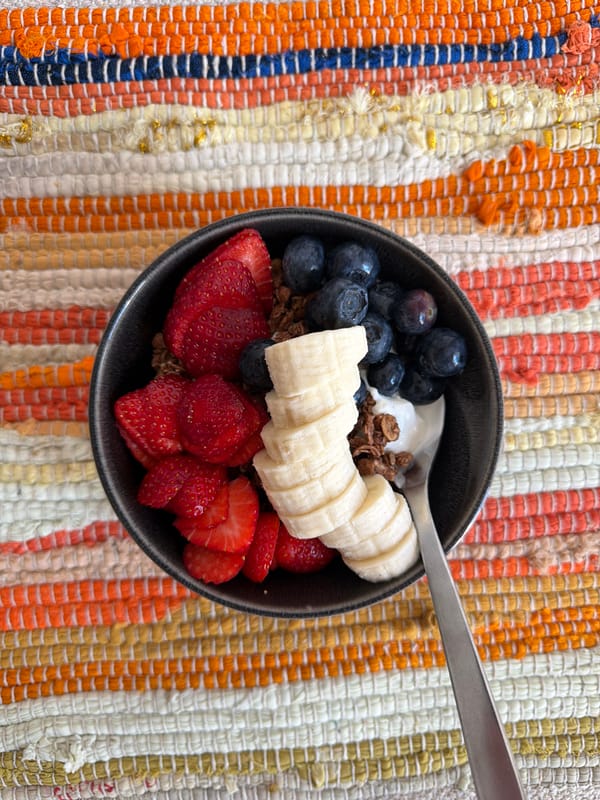 Breakfast bowl with mixed fruits and yogurt prepared