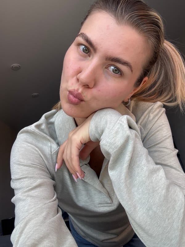 Woman documents morning selfies and city views from rooftop