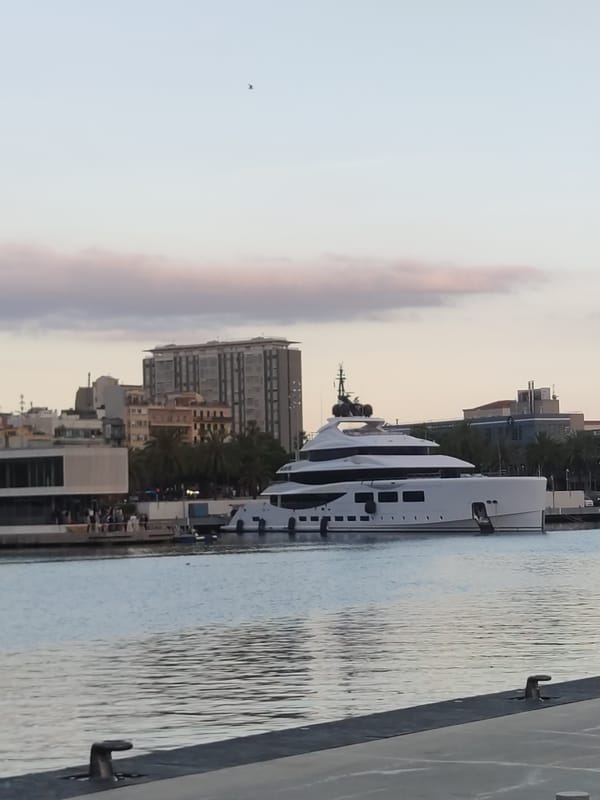 Evening harbor scenes and outdoor performance documented in Barcelona