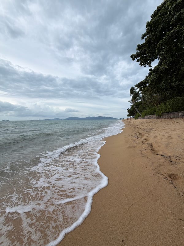 Wing foiling and coastal activity off Ko Samui on an overcast morning