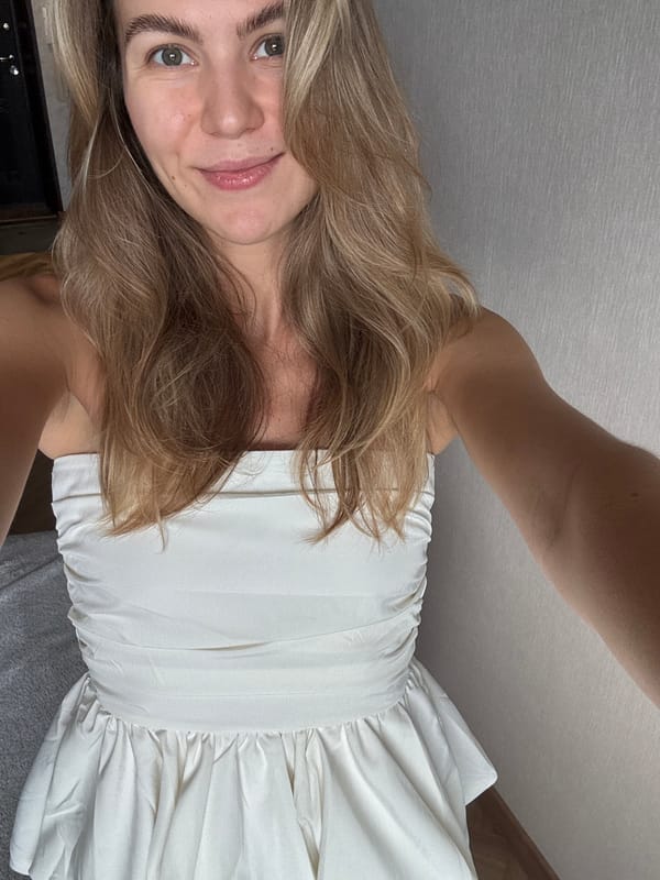 White dress selfies at home, with a Bengal cat nearby