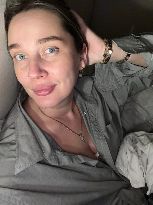 Person in gray shirt photographed lying down in Moscow
