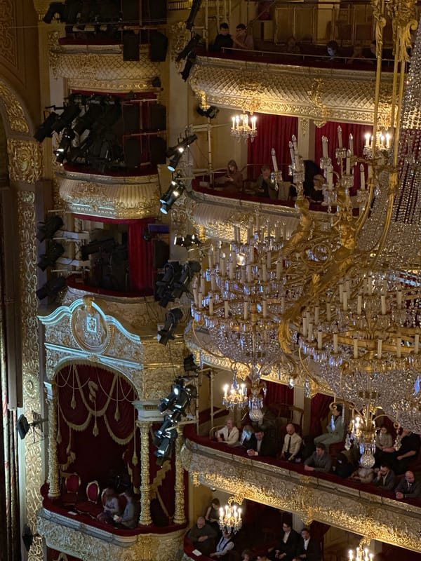 Theater audience gathers under ornate chandelier in Khimki