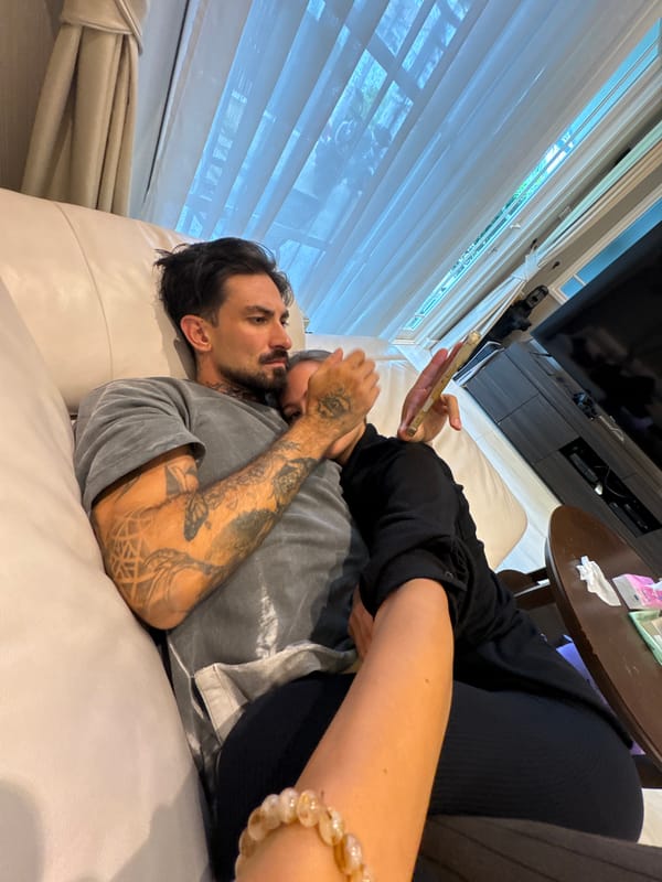 Couple shares intimate moments on sofa in Chalong home