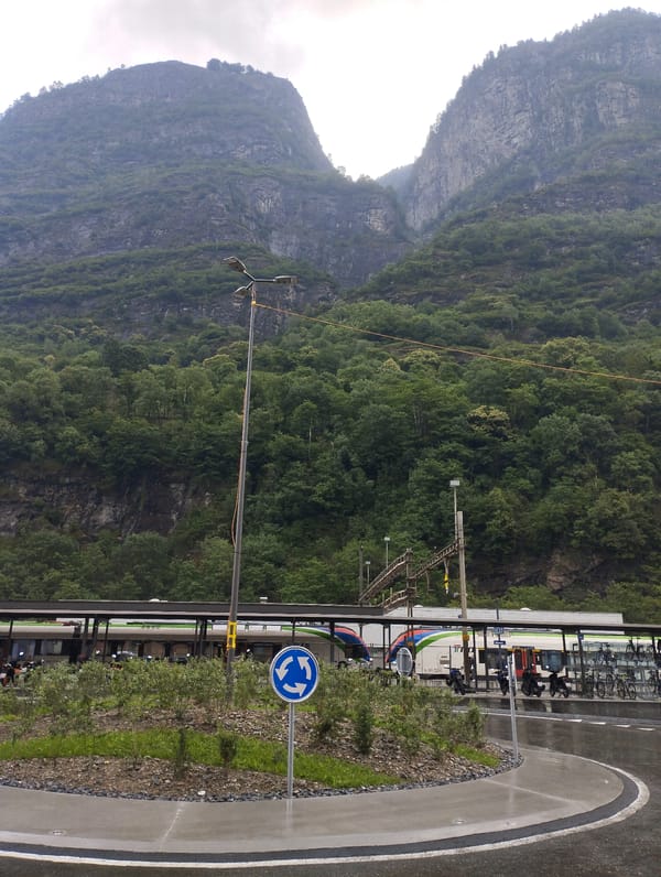 Routine morning activities documented across Biasca, Switzerland under cloudy skies
