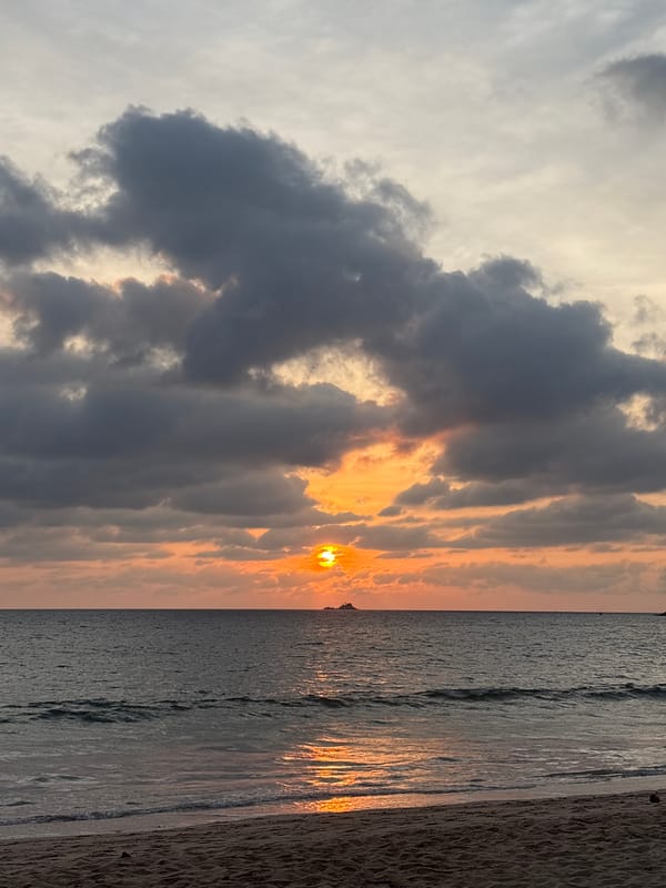 Beach burger dinner captured during Andaman Sea sunset