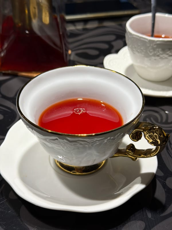 Domestic afternoon in Rossiyskiy: calico cat, home-cooked meal, tea