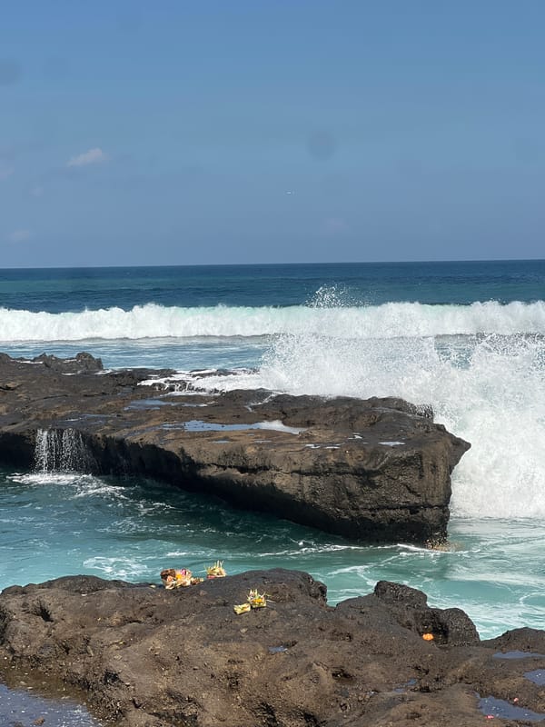 Surfers and beachgoers along Bali's North Kuta coastline