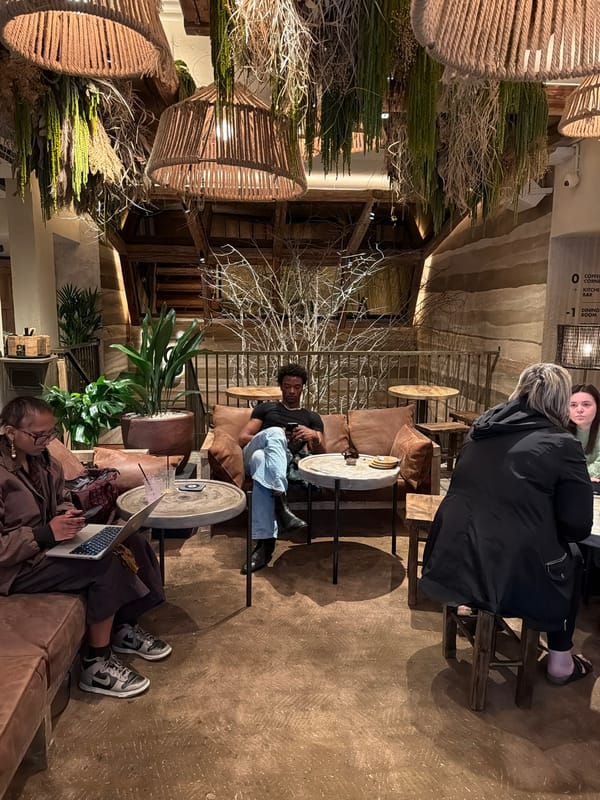 People work on devices in London cafe Sunday afternoon
