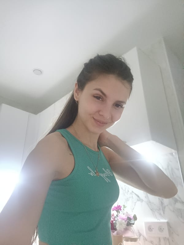 Woman documents cooking chicken and potatoes while taking selfies