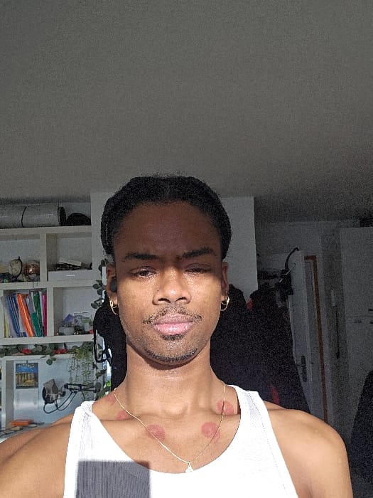 Man photographed indoors in Pantin residential setting