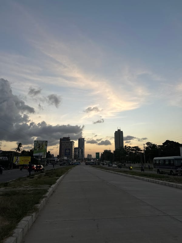 Dar es Salaam streets at dusk under a dramatic cloudy sky
