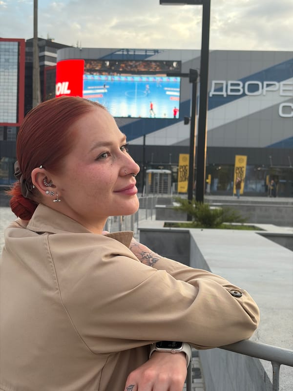 Woman photographs herself near Rostov-on-Don fountains and sports venues