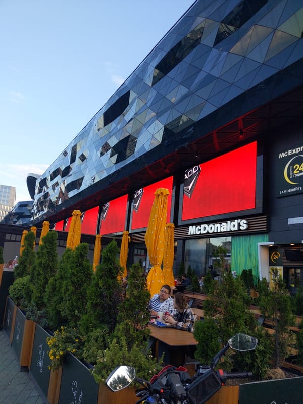 Street-level Kyiv: fast food, billboard ads, and a city bus