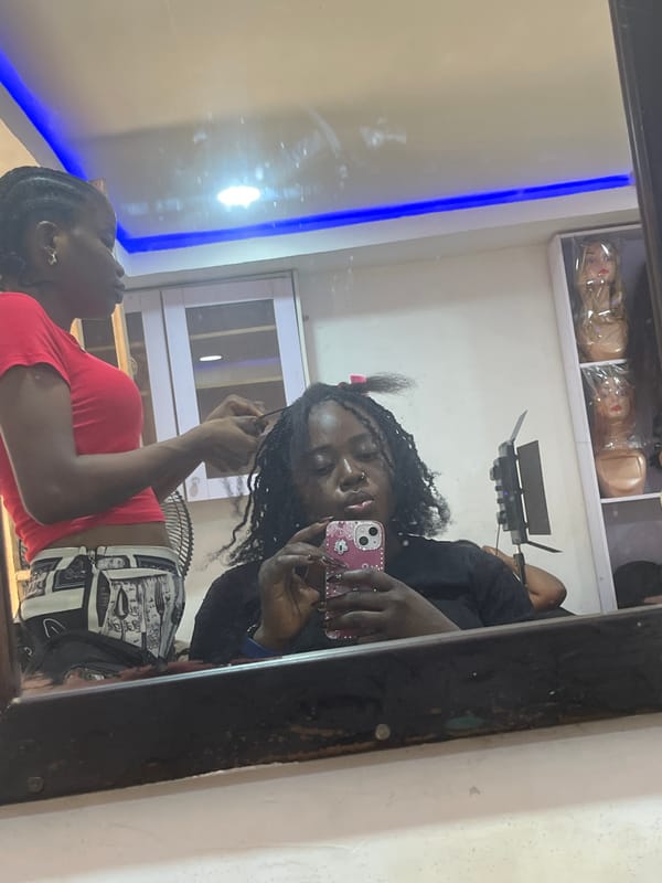 Abuja hair salon in full swing — braids, wigs, and selfies