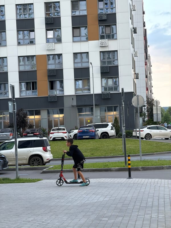 Busy residential streets in a Russian city on a grey afternoon
