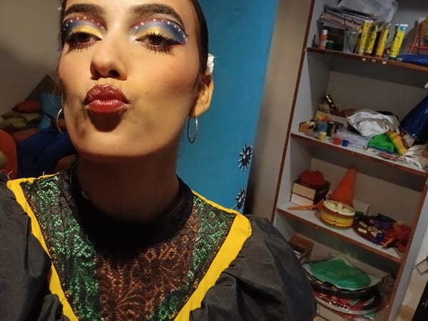 Woman poses in elaborate theatrical makeup at Venezuelan beach resort