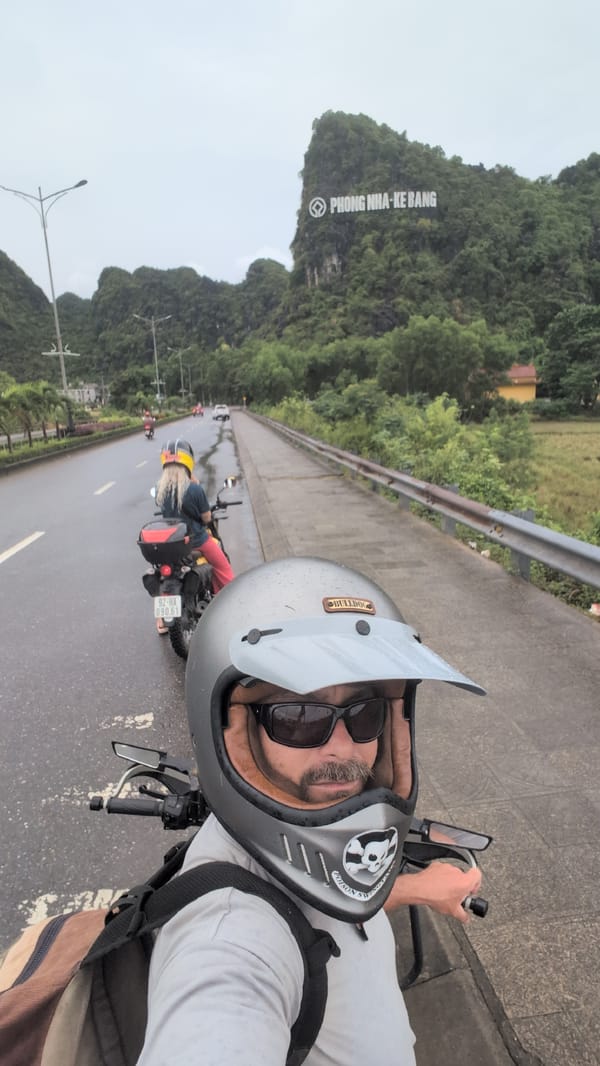 Motorcycle touring through wet roads in Phong Nha, Vietnam