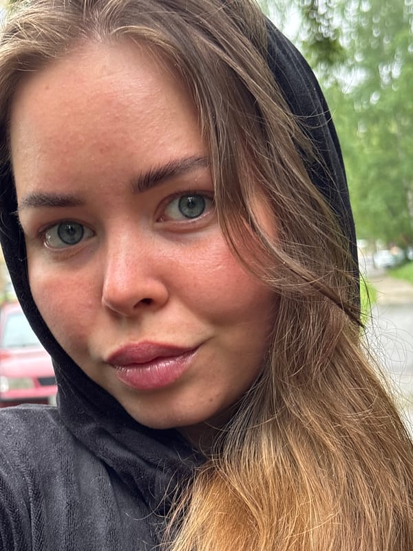 Woman takes selfie in black hoodie in Izhevsk