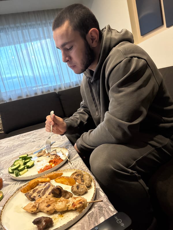 Man enjoys home meal on couch in Burgas