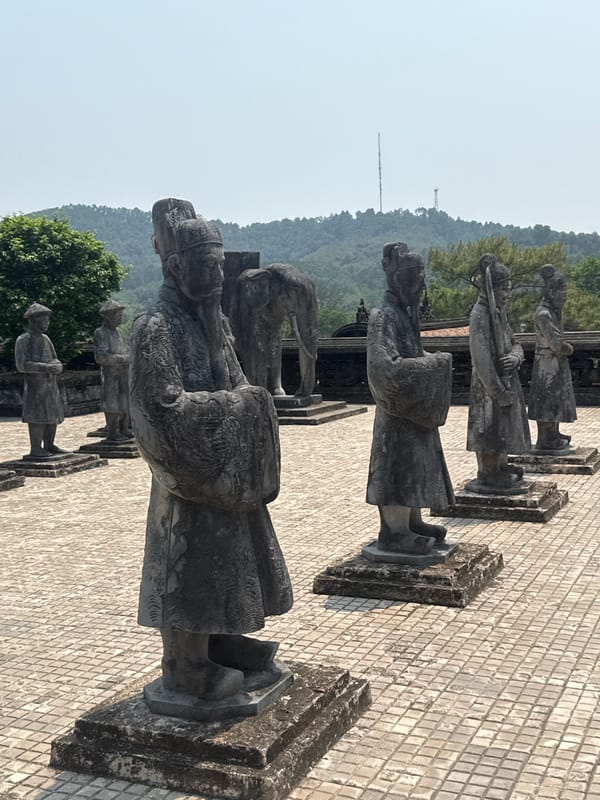 Traditional stone mandarin statues documented in Vietnamese ward