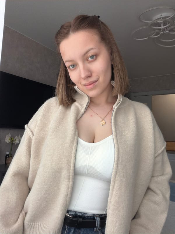 Young woman poses for indoor portraits in Reshetnikovo