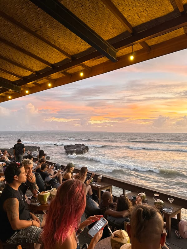 Sunset watchers gather at Canggu beachfront cafes during golden hour