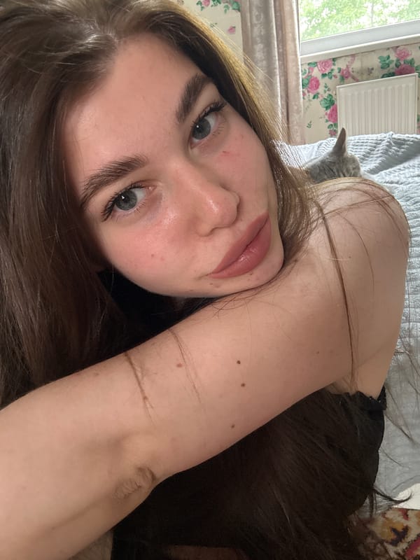 Woman with disheveled brown hair observed indoors in Russia