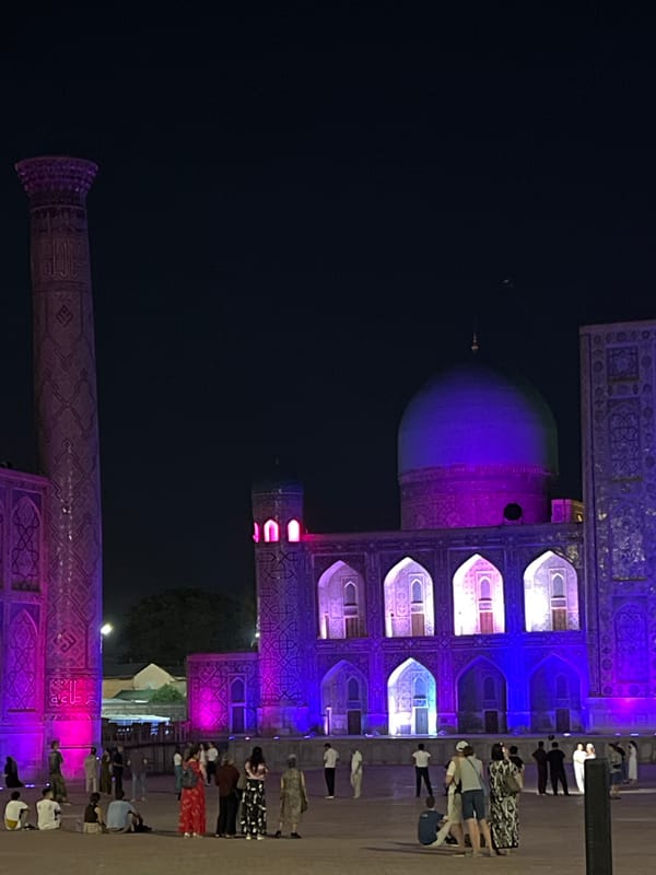 Registan Square draws evening crowds under colorful light displays