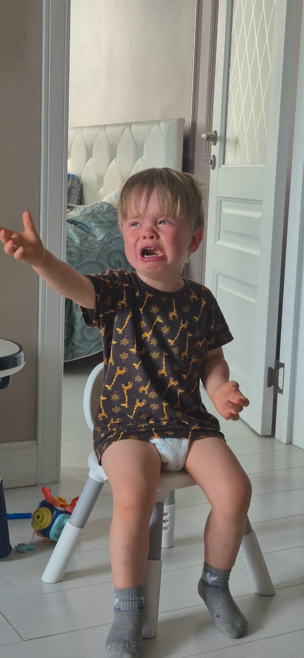 A morning at home with two kids, giraffe shirt and all.