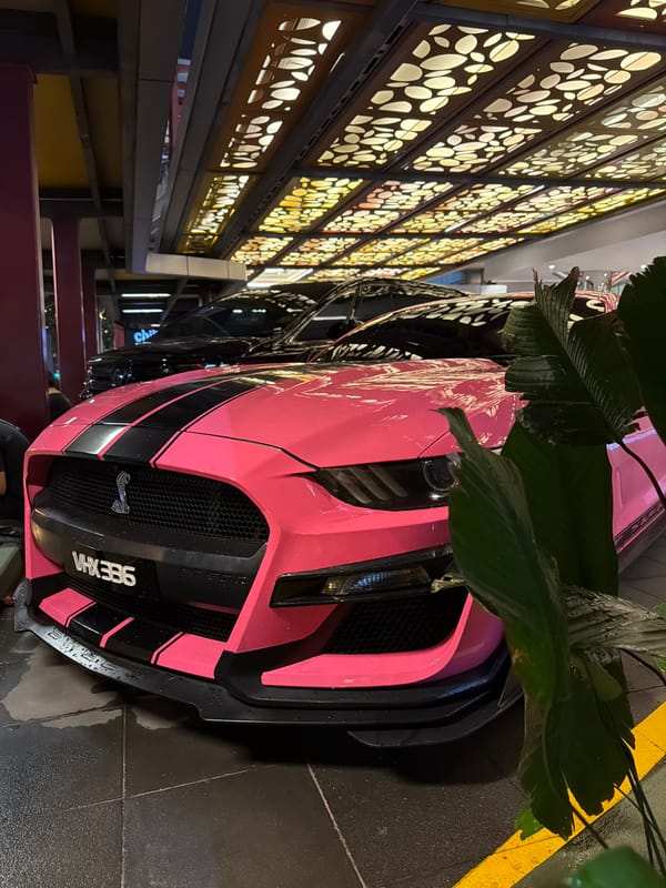 Pink Mustang GT500 parked at Kuala Lumpur mall entrance