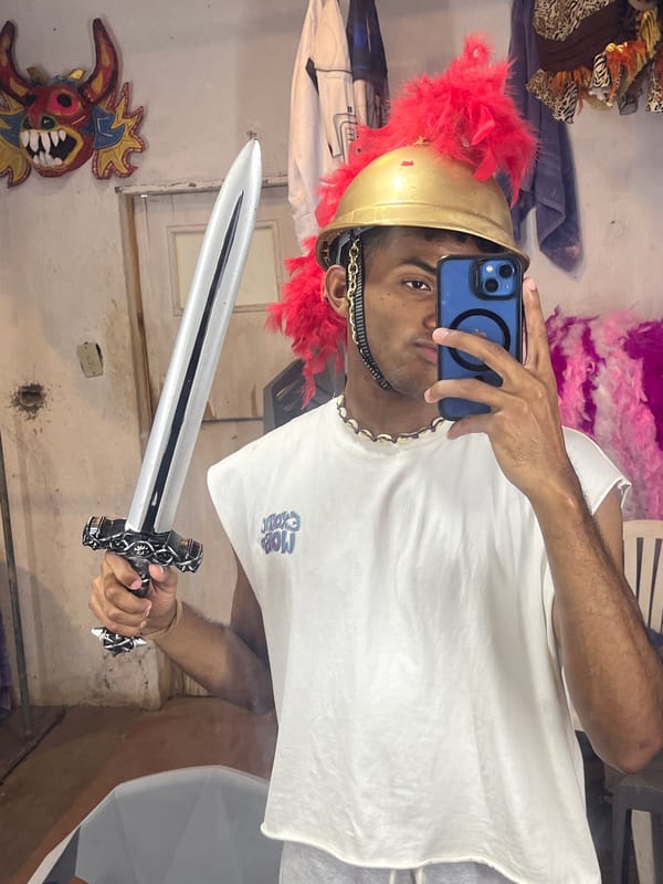 Person in Roman costume takes selfie in Porlamar