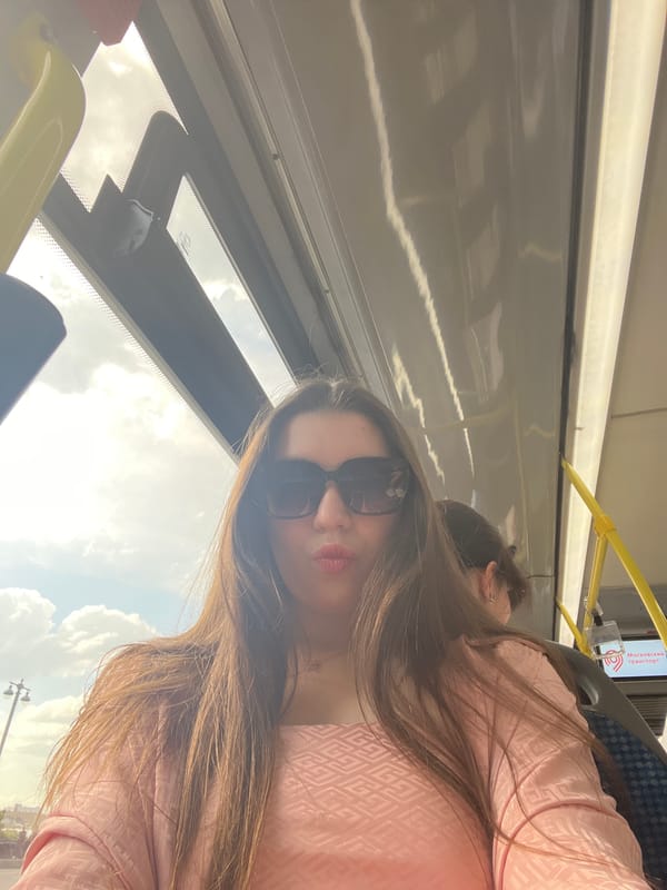 Woman rides Moscow bus as traffic flows through city streets