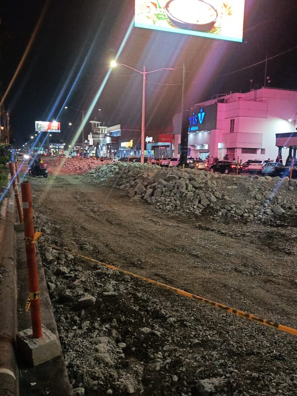 Guayaquil nighttime scenes show road construction and church