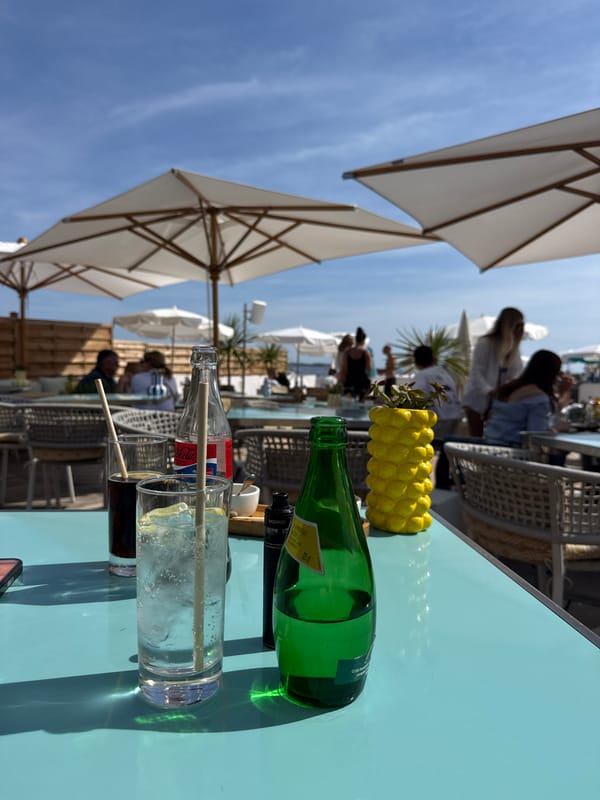 Outdoor dining scene captured at upscale Cannes café