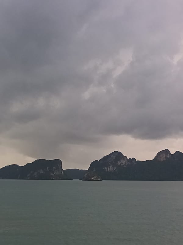 Ferry passenger documents cloudy Gulf crossing near Don Sak