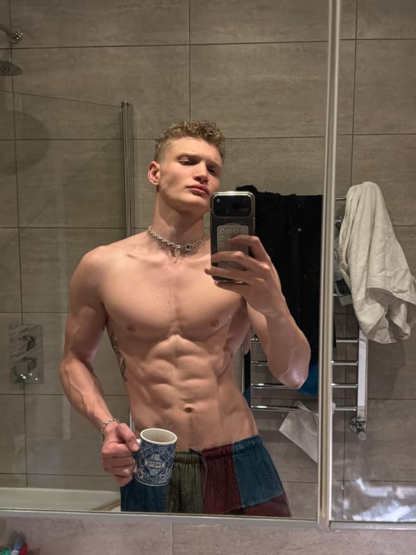 Man takes mirror selfie with cup in London