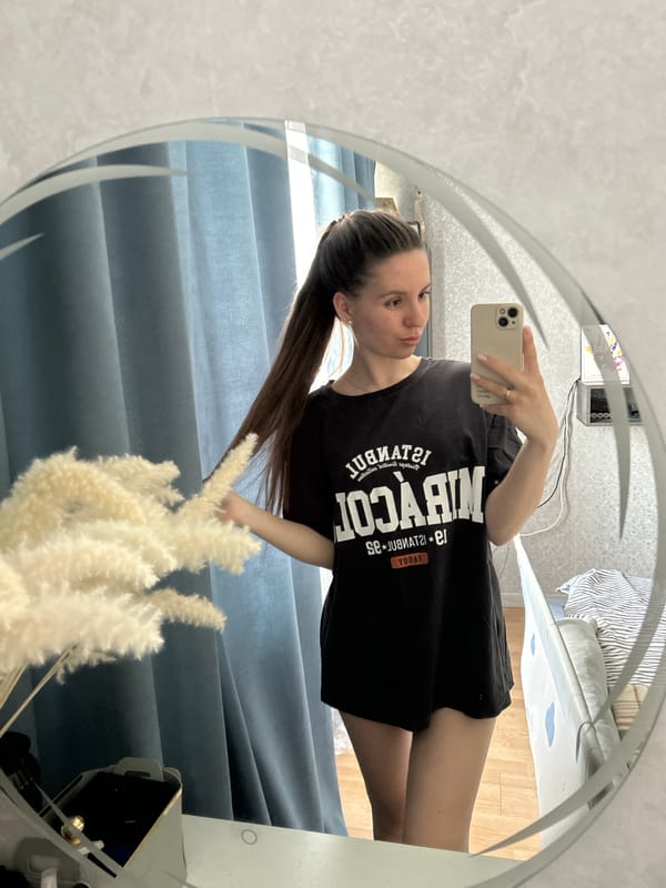 Woman takes mirror selfie in Klin, Russia