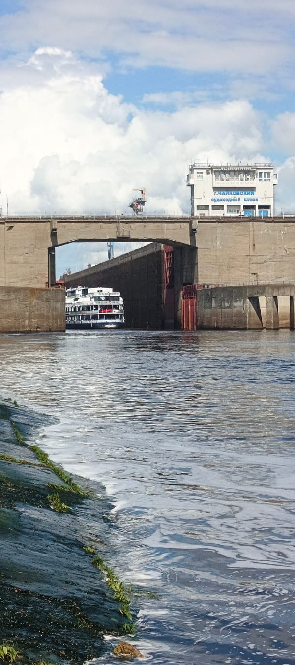 Cruise ship transits Russian river locks as fishermen watch